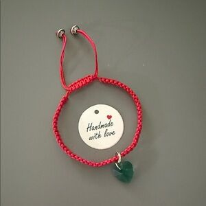 Adjustable Red Bracelet with Green Heart Charm